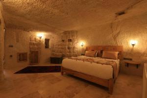 En eller flere senge i et værelse på Gazel Cave House