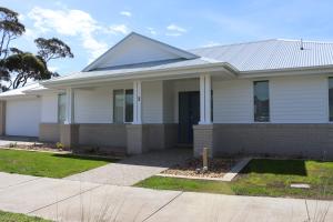 a large white house with at Seafoam, Cowes, New Home, Fast NBN WIFI in Cowes
