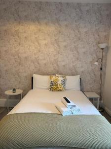 Ένα ή περισσότερα κρεβάτια σε δωμάτιο στο TLK Apartments & Hotel - Beckenham Junction