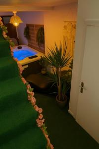 a room with a pool and a room with plants at Escapade Secrète in Obernai +3 photos