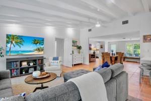 a living room with a couch and a table at Lavender Lagoon in Anna Maria