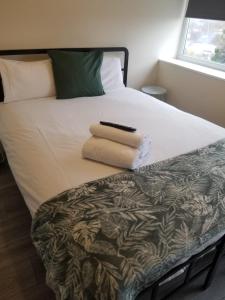 Ένα ή περισσότερα κρεβάτια σε δωμάτιο στο TLK Apartments & Hotel - Beckenham Junction +16 φωτογραφίες