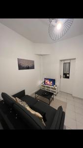 Posezení v ubytování Saint Quentin city center apartment