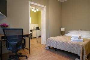 Postel nebo postele na pokoji v ubytování Apartamenty Poznańska 32