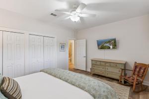 Ένα ή περισσότερα κρεβάτια σε δωμάτιο στο Simone Tranquilla - 2010 Bruce Drive