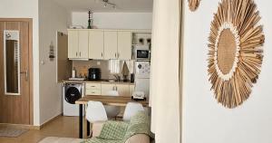 a kitchen and dining room with a table and chairs at Happy Studio in Drama +33 photos