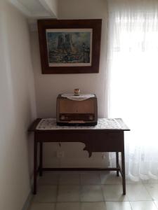 a table with a radio on it in a room at Maison Puigpelat in Puigpelat
