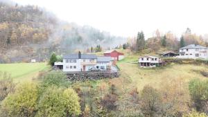 an aerial view of a house on a hill at Utsikten in Masfjorden