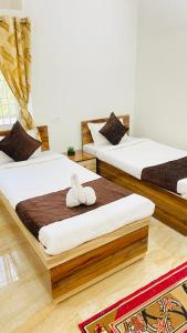 Кровать или кровати в номере The Green Haven Homestay +17 фотографий