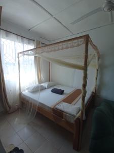 Ένα ή περισσότερα κρεβάτια σε δωμάτιο στο Danthri