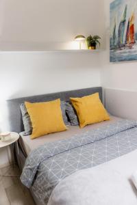 Ένα ή περισσότερα κρεβάτια σε δωμάτιο στο PASSAGE Center