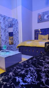 Ένα ή περισσότερα κρεβάτια σε δωμάτιο στο Appart Séjour plus Bénin