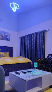 Ένα ή περισσότερα κρεβάτια σε δωμάτιο στο Appart Séjour plus Bénin