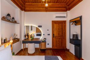 a room with a table and a desk in it at Elmoria Pera In Hotel in Istanbul +13 photos