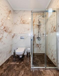a bathroom with a toilet and a shower at Elmoria Pera In Hotel in Istanbul