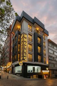 a building with a sign on the side of it at QUİ Hotel&SPA in Istanbul