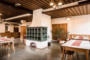 a large room with tables and a fireplace at Monteurhaus in Hausham