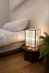 Postel nebo postele na pokoji v ubytování Sodamjae Stay, near Seokchon Lake 5 guests + 5 fotografií