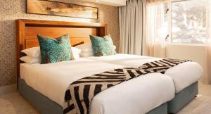 Postel nebo postele na pokoji v ubytování Nedbank Golf Challenge Sun City Vacation Club