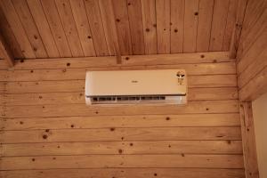 a laptop on the ceiling of a room at Sameer beachfront Cottages in Canacona