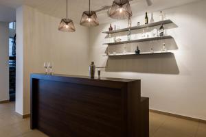 a room with a bar with shelves and a table at Silver Mist in Kodaikānāl +50 photos