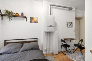 Ένα ή περισσότερα κρεβάτια σε δωμάτιο στο Cosy mini-appartment in Prenzlauer Berg