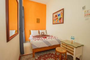 Ένα ή περισσότερα κρεβάτια σε δωμάτιο στο The Cabin Hotel Ambasador