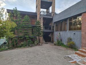 a house with a large plant on the side of it at Mount Olive Hotel Laibela in Lalibela