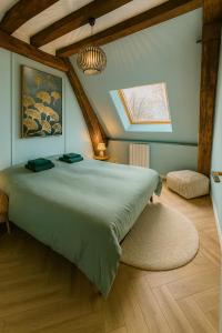 Postel nebo postele na pokoji v ubytování La Villa Eden