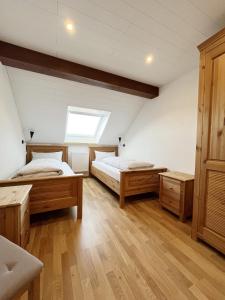 Ένα ή περισσότερα κρεβάτια σε δωμάτιο στο Bergnescht - Dein Wohnfühlort im Schwarzwald +16 φωτογραφίες