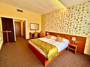 Postel nebo postele na pokoji v ubytování Avanti Hotel + 79 fotografií