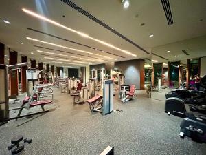 a gym with a lot of exercise equipment in it at Luxurious 3 BR with Burj Khalifa View in Downtown in Dubai