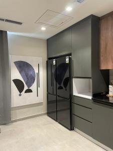 Кухня или мини-кухня в Aeon Towers Hotel Apartment شقة فندقية في أبراج إيون مول العرب" في السادس من أكتوبر
