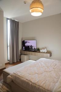 Кровать или кровати в номере Aeon Towers Hotel Apartment شقة فندقية في أبراج إيون مول العرب" في السادس من أكتوبر