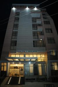 a tall building with a sign that reads korea train your hotel at Yofel Hotel in Dirē Kʼalu +3 photos