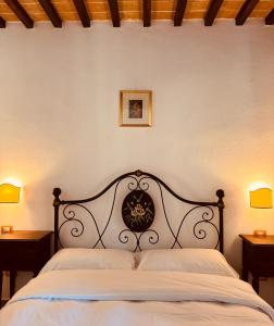 Ένα ή περισσότερα κρεβάτια σε δωμάτιο στο Agriturismo Ponte Di Riocchio