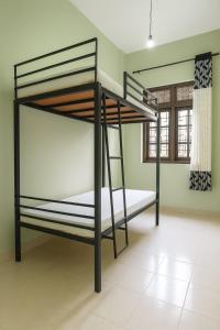 a bedroom with two bunk beds in a room at Comfy Stay in Badulla