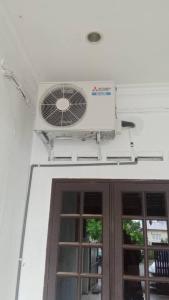 a building with a fan above a door at hotel mutiara KGM in Malacca