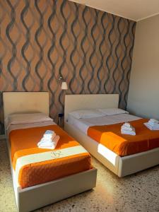 Ένα ή περισσότερα κρεβάτια σε δωμάτιο στο Pompei Sanctuary rooms