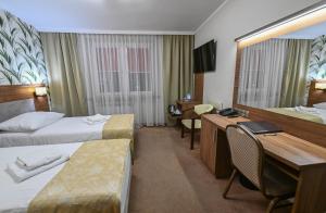 TV a/nebo společenská místnost v ubytování Cumulus Hotel