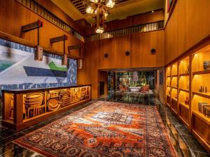 a large room with a rug on the floor at Mercure Hida Takayama in Takayama