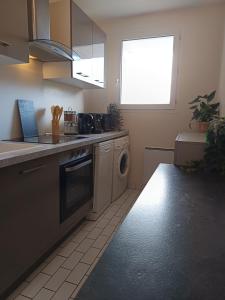 Kuchyň nebo kuchyňský kout v ubytování Le Cocon Serenité + 1 fotografie