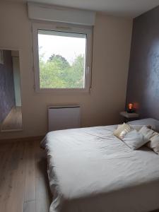 Postel nebo postele na pokoji v ubytování Le Cocon Serenité