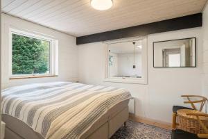 Postel nebo postele na pokoji v ubytování Summerhouse in Gilleje