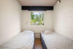 Postel nebo postele na pokoji v ubytování Summerhouse in Gilleje