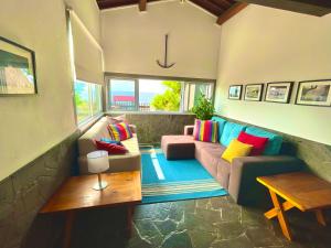 a living room with a couch and a table at Sea Roots "Sea Zone" in Mosteiros +61 photos