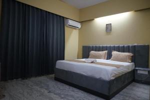 Giường trong phòng chung tại Hotel Fortune Stay