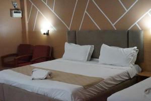 Giường trong phòng chung tại Hotel Fortune Stay
