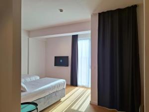 Ένα ή περισσότερα κρεβάτια σε δωμάτιο στο Hotel Mooma +130 φωτογραφίες