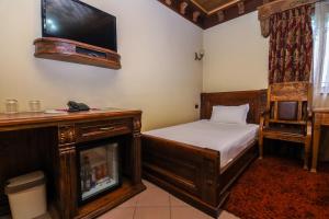 Ένα ή περισσότερα κρεβάτια σε δωμάτιο στο Hotel BRILANT ANTIK City Center